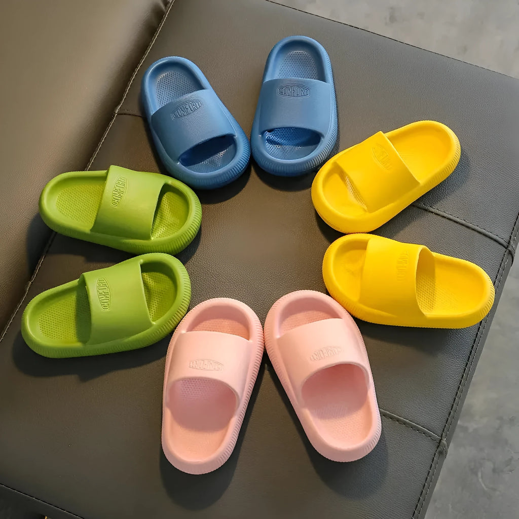 Children's mixed colour EVA slippers with a non-slip sole, shown in blue, green, orange, pink, and yellow.
