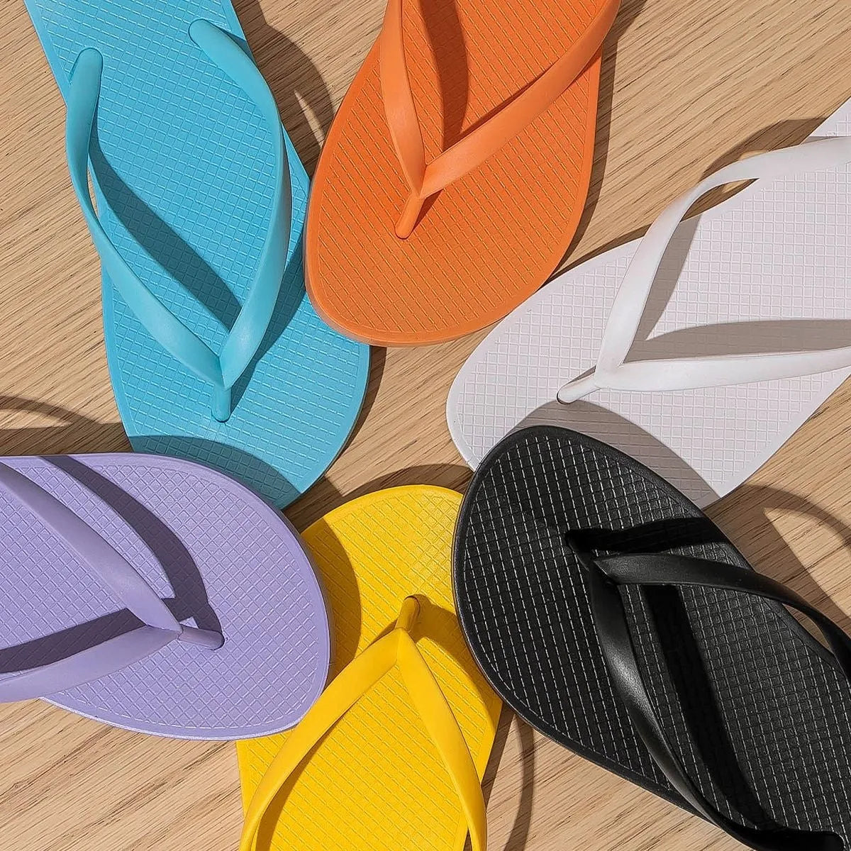 Foldable casual beach slipper with hollow-out plastic upper and non-slip PVC sole.