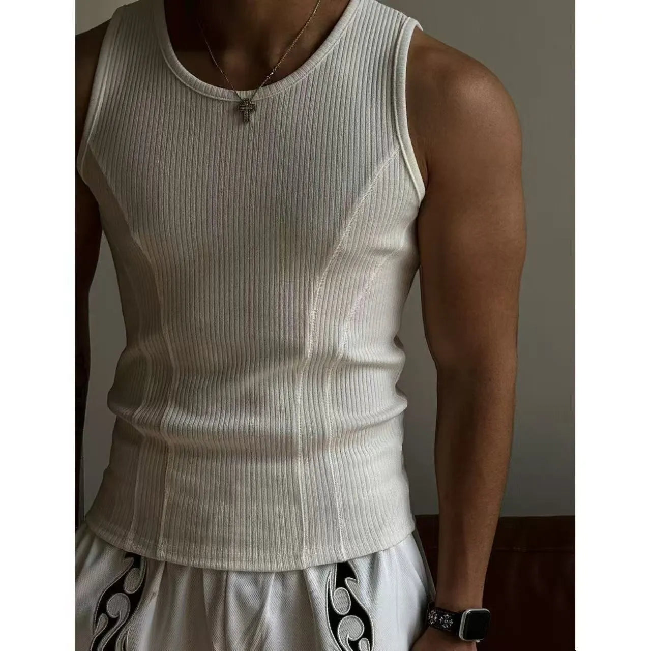 Black men's tight-fitting polyester sports vest tank top on a mannequin, front view.