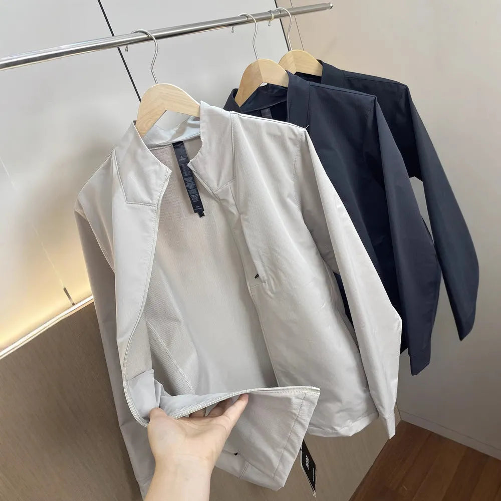 Men's beige stand collar polyester casual jacket with long sleeves and straight hem.