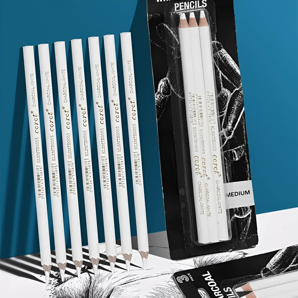Set of three white charcoal drawing pencils with wooden casings.