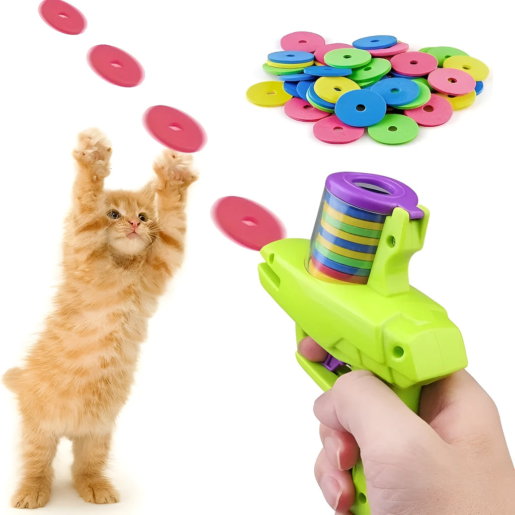 Green interactive cat toy launcher with foam disc on flat indoor surface.