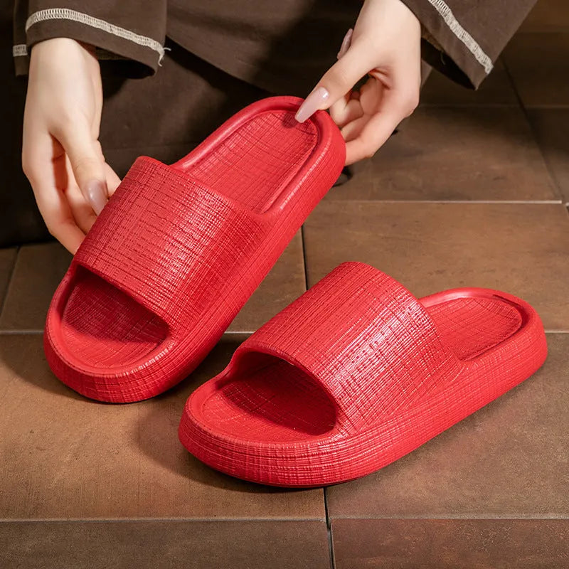 Pair of adult unisex EVA toe-ring slippers in a chosen colour, showing the non-slip sole and flip-flop design.