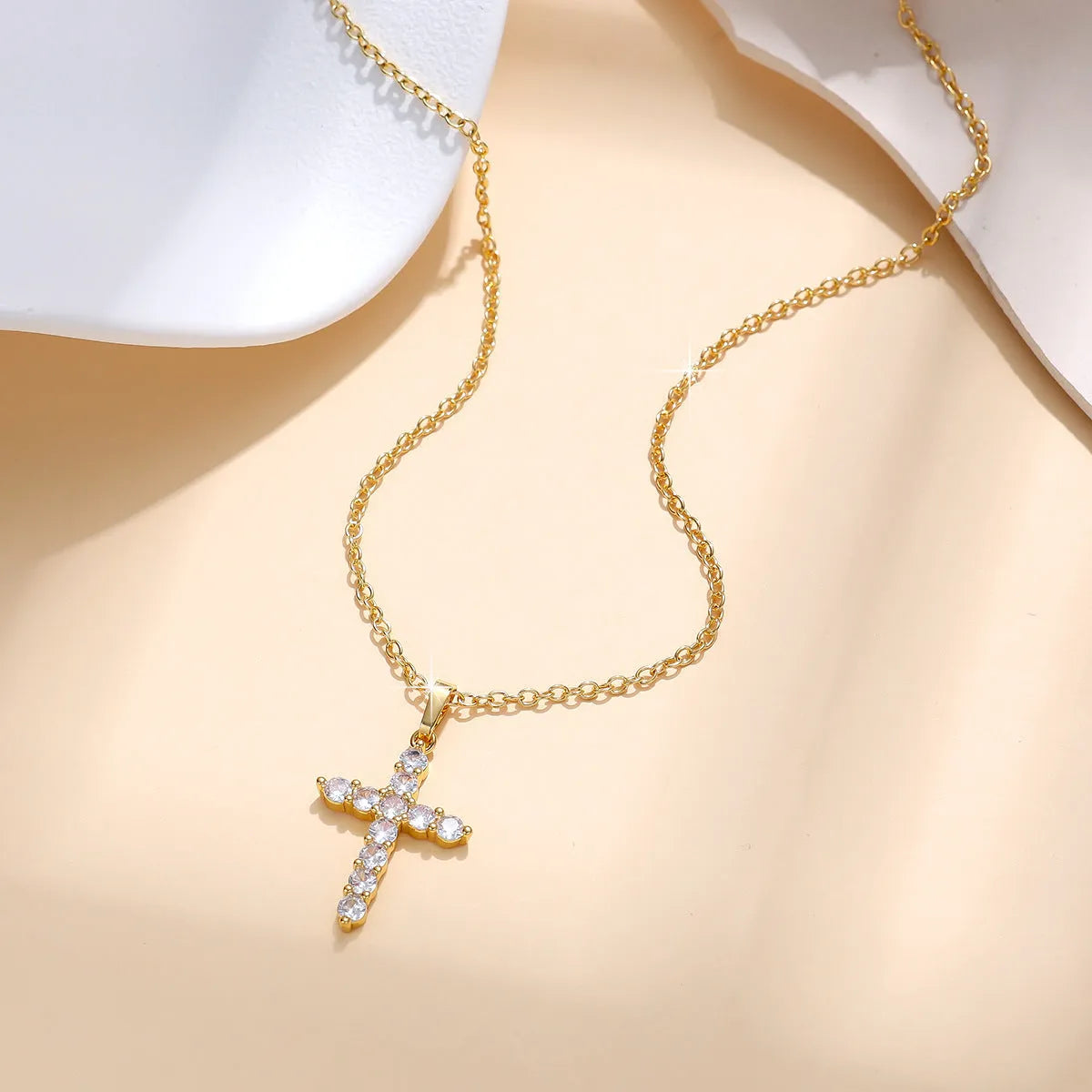 Gold plated cross necklace for women with cubic zirconia stones on a 45 cm chain, shiny finish