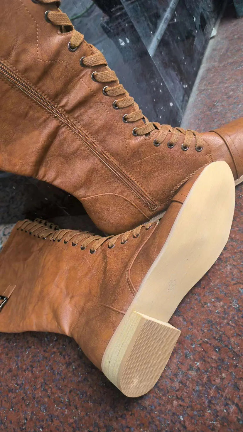 Women's black synthetic PU knight boots with a cross-strap design on the upper.