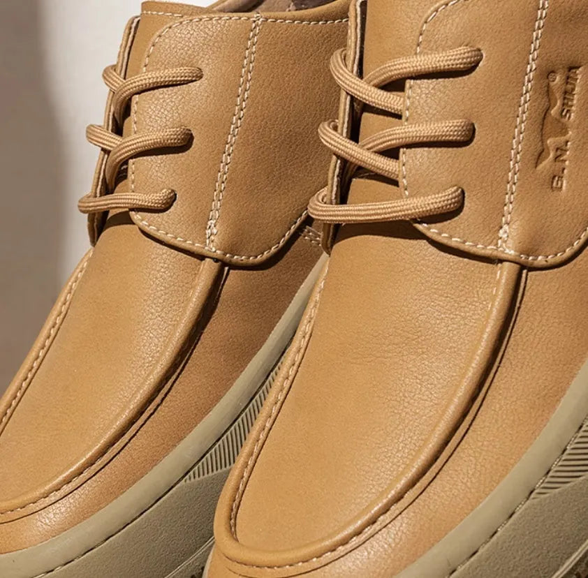 Brown retro-style casual leather shoes with big toe design on a neutral background