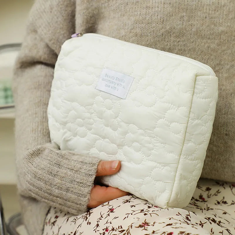 Quilted silk storage bag for women in candy colours showing medium and large size options