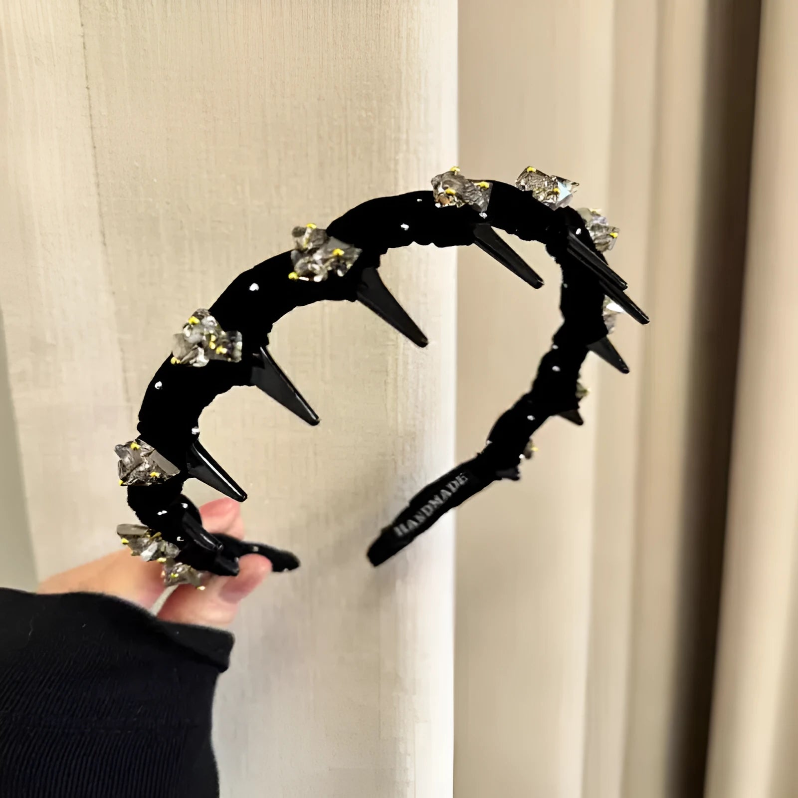 French velvet hair band with crystal wave design and non-slip grip.