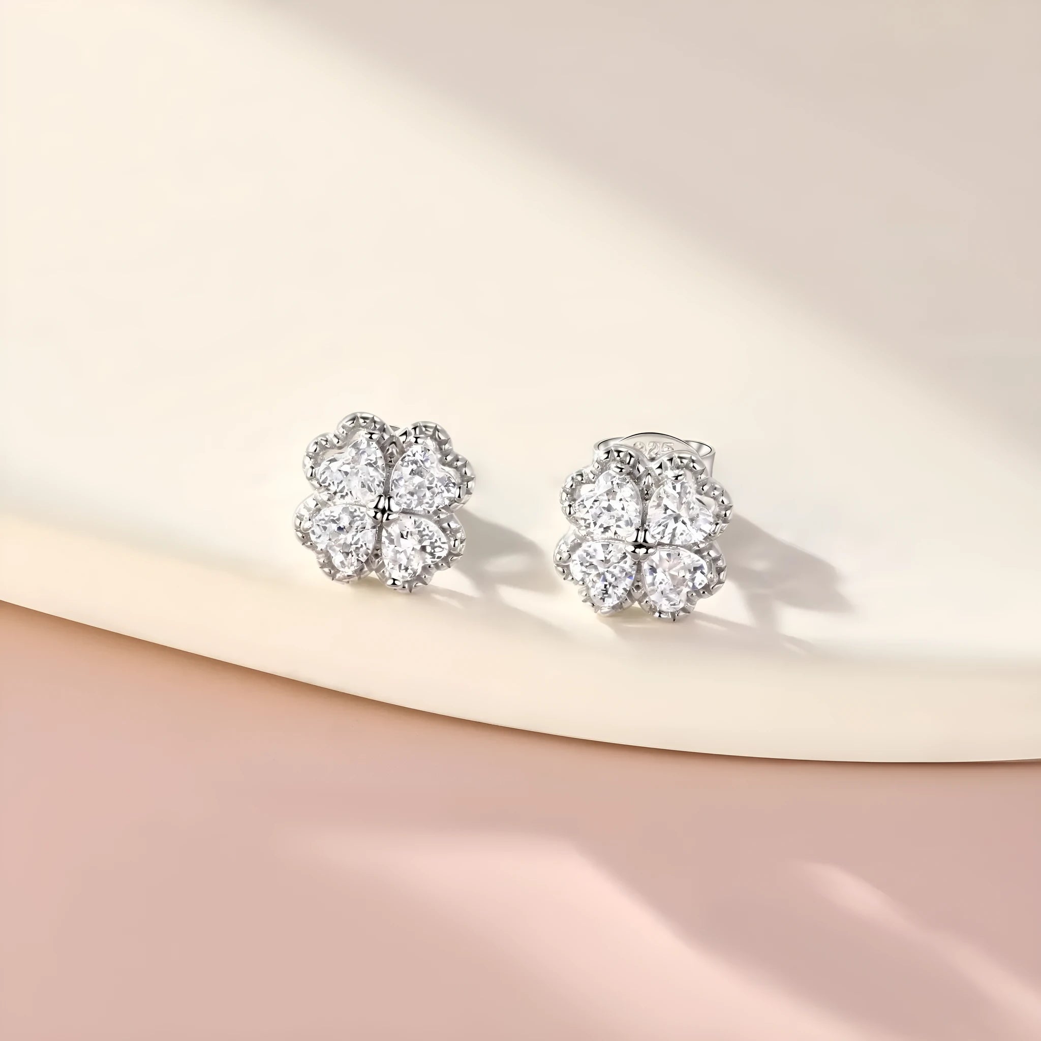Zeng Yin women's silver four-leaf clover earrings with zircon stone in white gold colour.