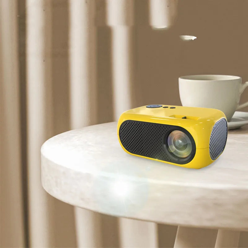 M24 micro mini portable LED projector in gold or white colour with power adapter and AV cable