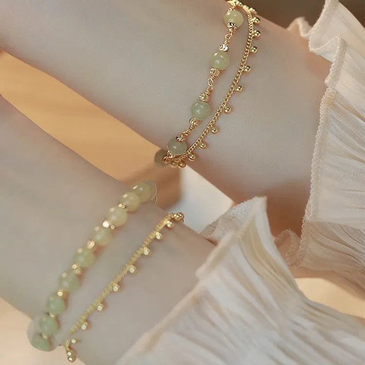 Handcrafted natural Hetian jade bracelet showing bead and charm style variations