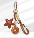 Handmade soda bread style handbag pendant with brown star and baked varnish finish