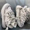 Women's grey retro chunky platform sneakers with a thick rubber sole and lace-up front.