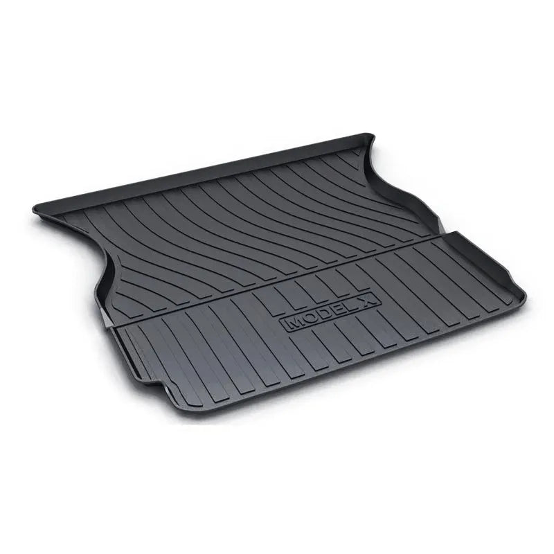 Custom rubber floor mats for Tesla cars, showing TPE footrest section and model-specific contours.