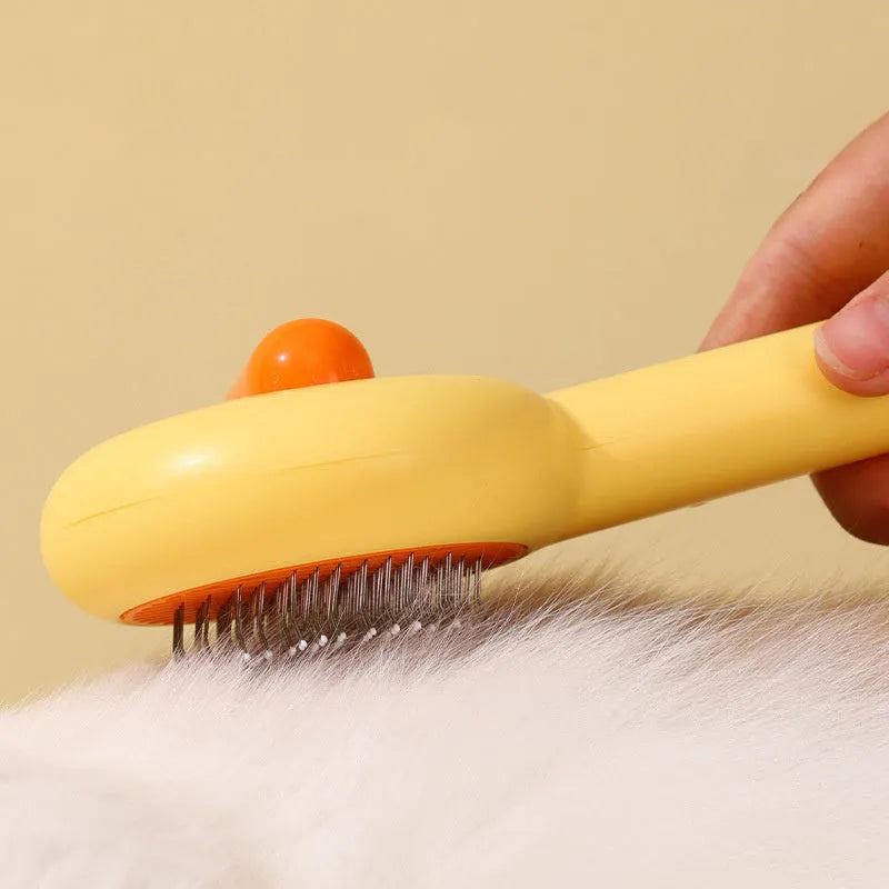 Small yellow duck comb for cat and dog hair removal with open section design