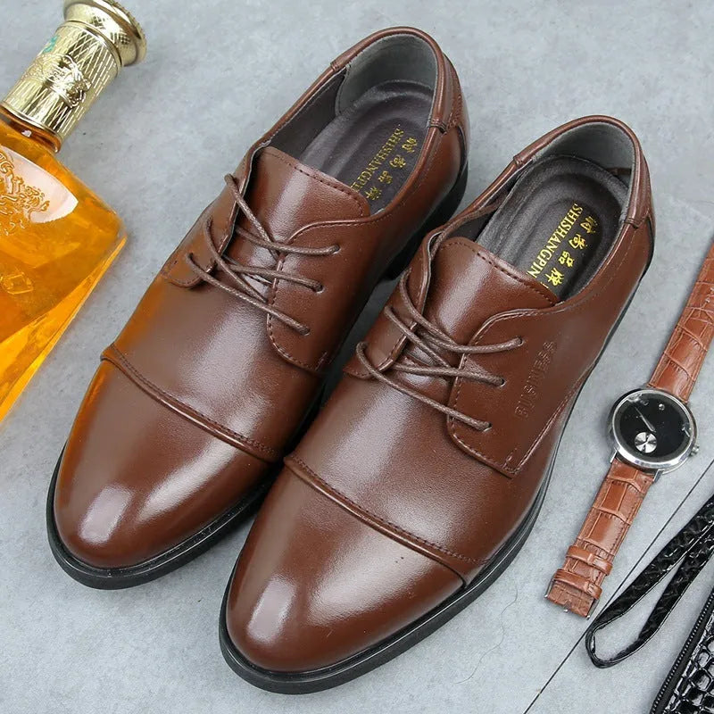 Men's black formal lace-up shoes with stitching detail on a rubber sole