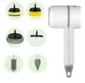 Green rechargeable electric cleaning brush with three interchangeable scrub heads on a kitchen counter.