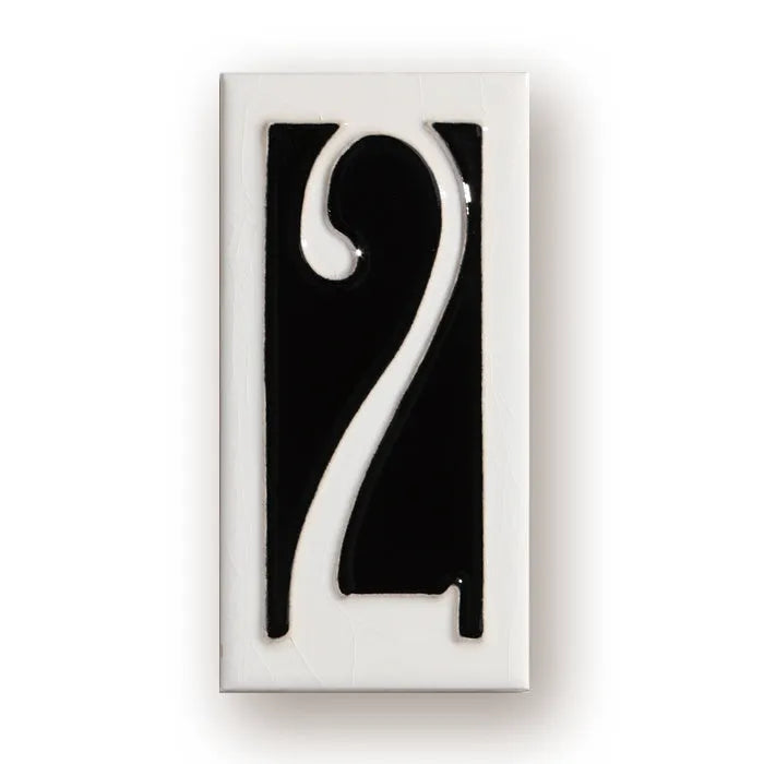 Handmade retro-style ceramic doorplate with white enamel number on a blue glazed background.