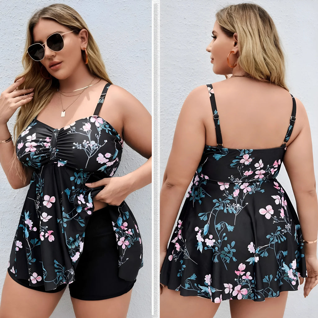 Women's floral print one-piece swimsuit with split colour design, shown on a hanger.