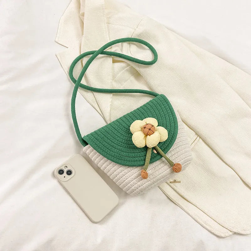Women's cotton linen straw bucket bag with handwoven flower detail, crossbody strap, five colour options