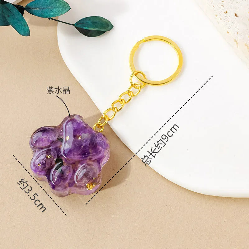 Natural crystal cat's paw keychain pendant on a keyring, colour varies by random gemstone type.