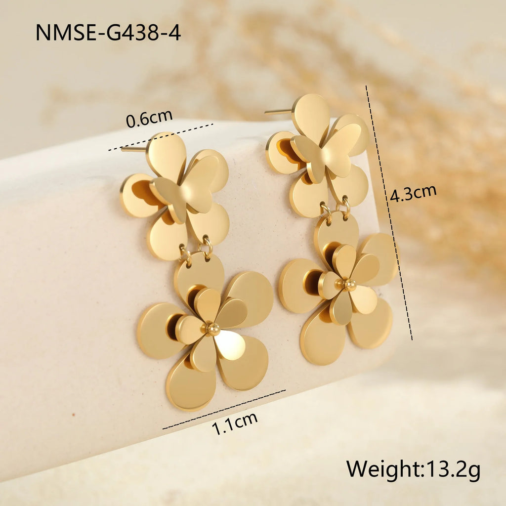 Gold-coloured stainless steel butterfly flower earrings with geometric and zodiac design elements
