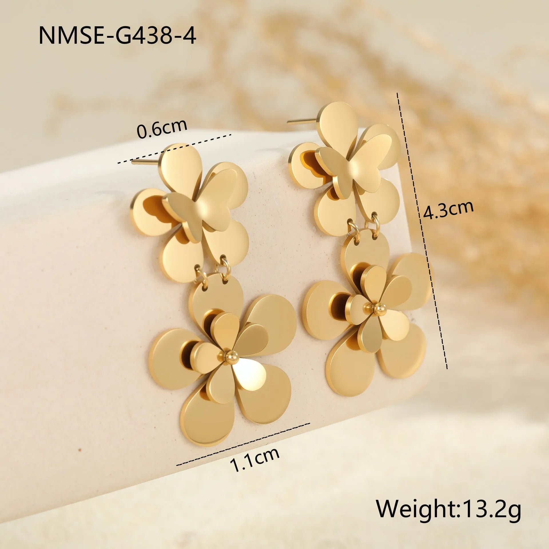 Gold-coloured stainless steel butterfly flower earrings with geometric and zodiac design elements