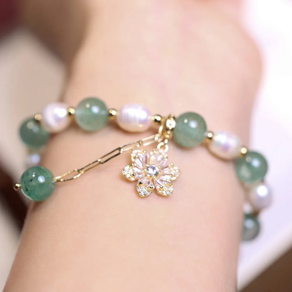 Green handmade freshwater pearl bracelet with strawberry pearls and Chinese knot design