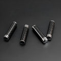 Set of four carbon fibre and metal car door lift decorative covers for direct replacement installation.