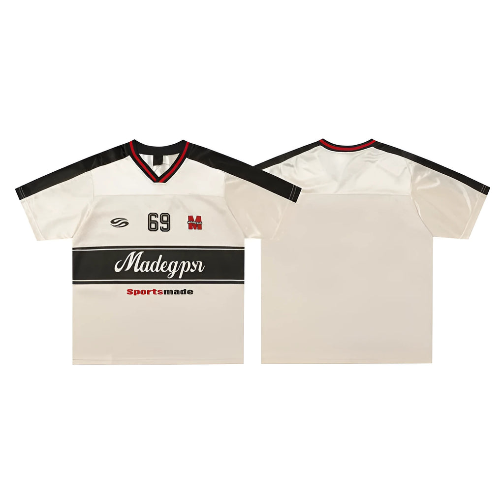 Apricot-coloured loose fit sports T-shirt with a printed letter design and drop-shoulder sleeves.