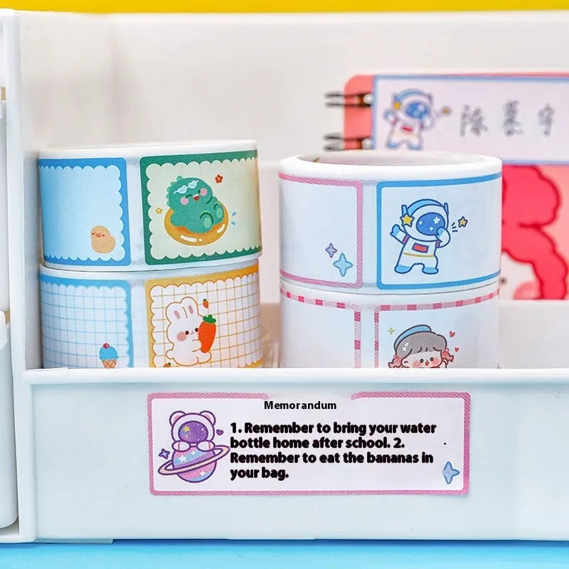 Roll of colourful cartoon name tape stickers showing dinosaur, astronaut, rabbit and girl designs