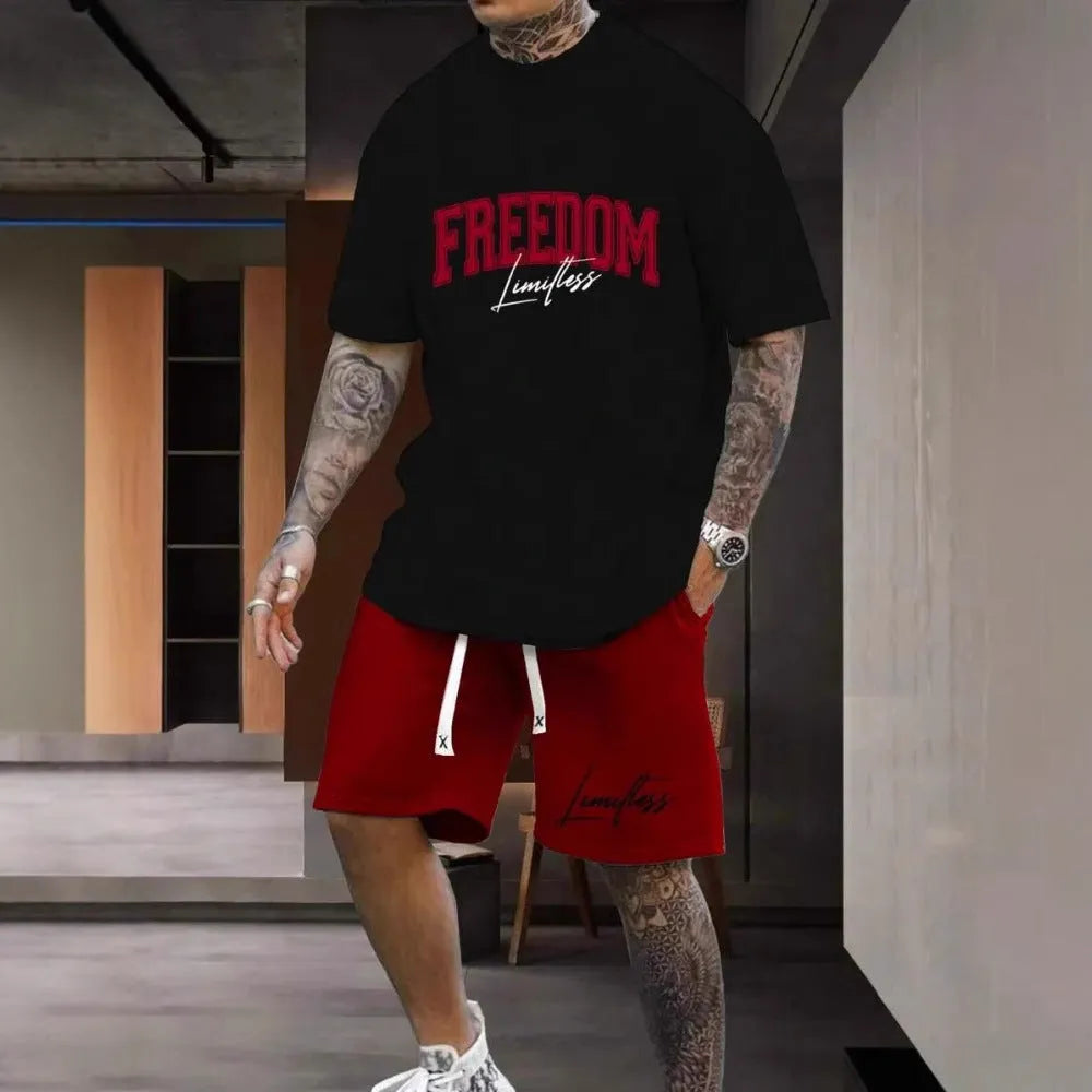 Men's grey sports suit with 3D printed text on the chest, showing short sleeve top and matching shorts.
