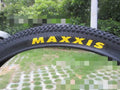 Mountain bike ultralight puncture-resistant tyre showing tread pattern and sidewall with size options