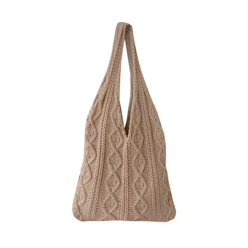 Women's retro-style hollow-knitted wool yarn tote bag in a solid colour, showing double shoulder straps.