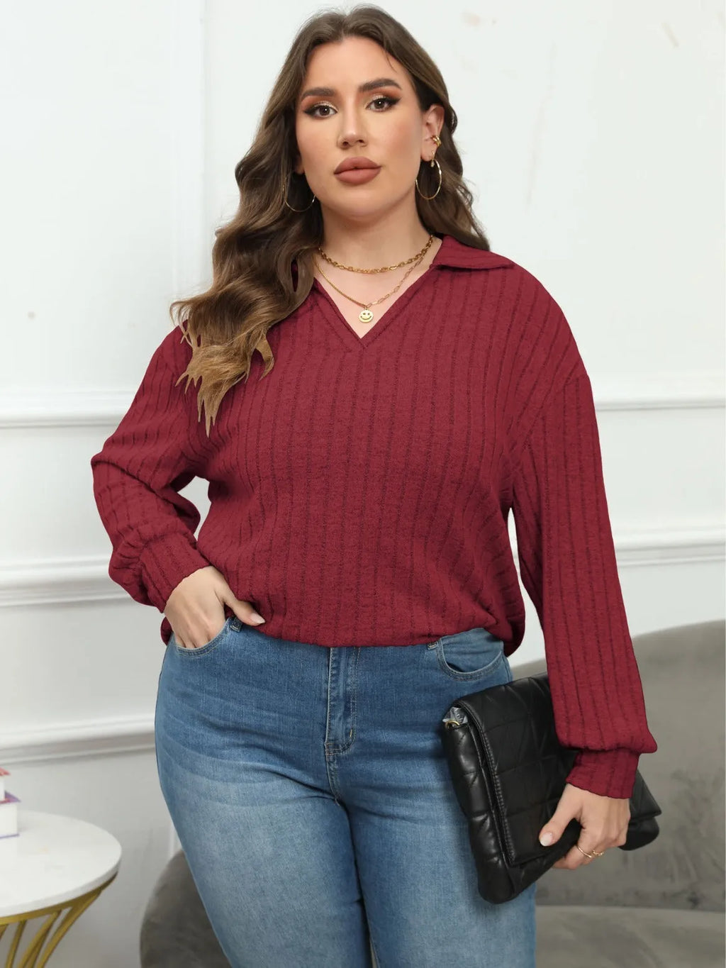 Women's plus size grey polo collar fleece shirt with lantern sleeves on a hanger.