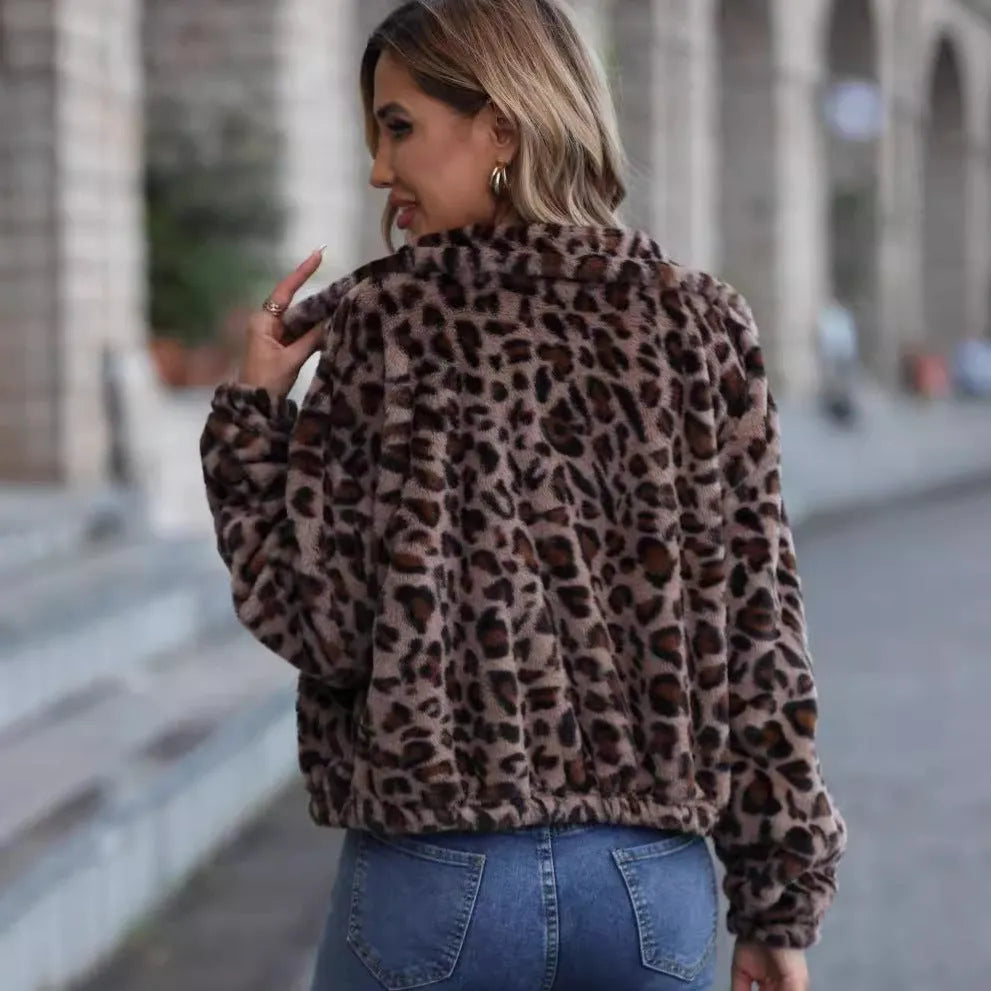 Women's loose leopard print plush coat with zipper front and raglan sleeves.