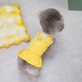 Orange and yellow patchwork striped cotton skirt for dogs on a mannequin