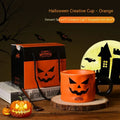 Orange ceramic Halloween pumpkin mug with handle and dessert spoon in gift box packaging