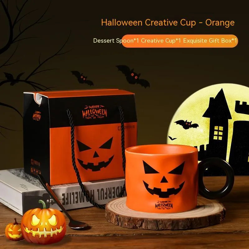 Orange ceramic Halloween pumpkin mug with handle and dessert spoon in gift box packaging