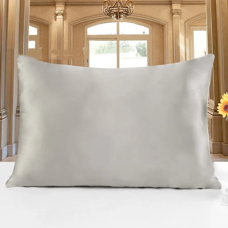 19 M double-sided silk pillowcase shown in one of 14 available colours, including apricot, sky blue, and black.