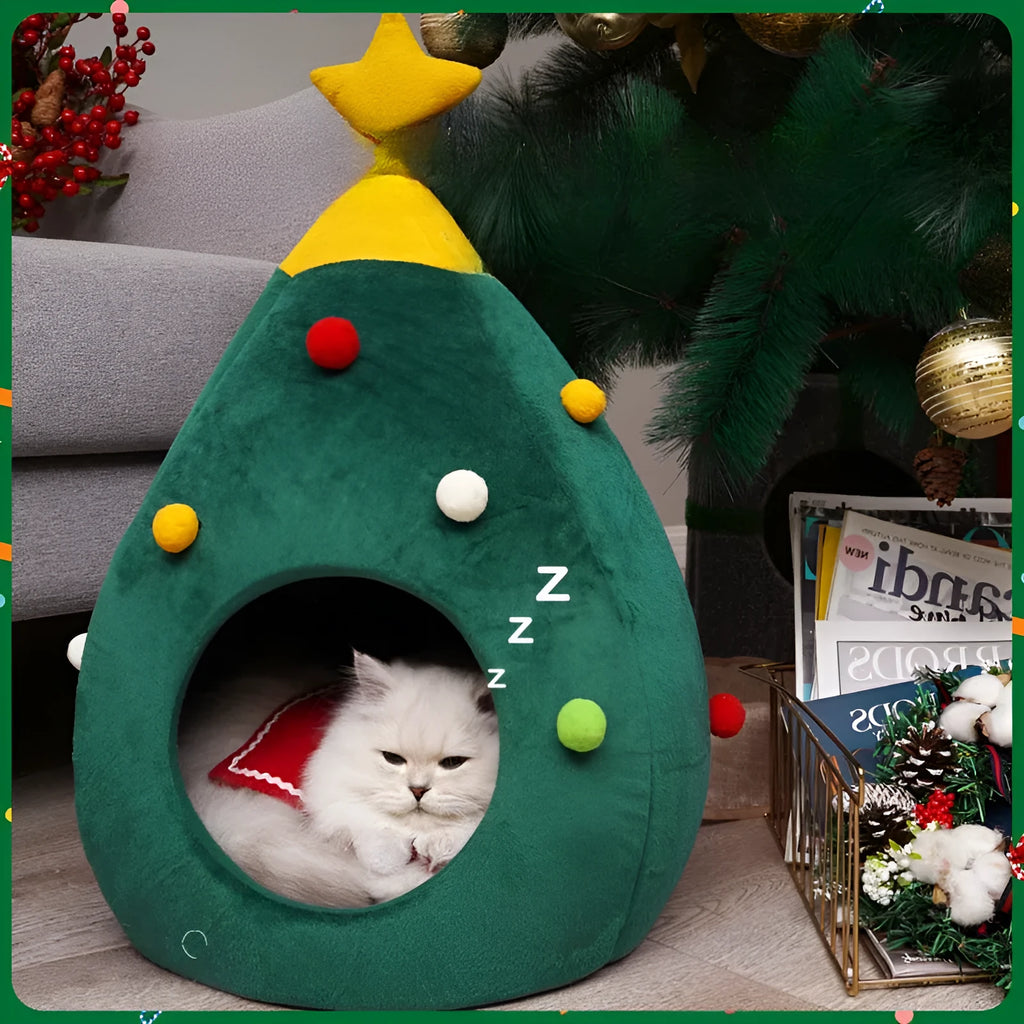 Red Christmas tree shaped plush cave bed for cats and small dogs on a wooden floor.
