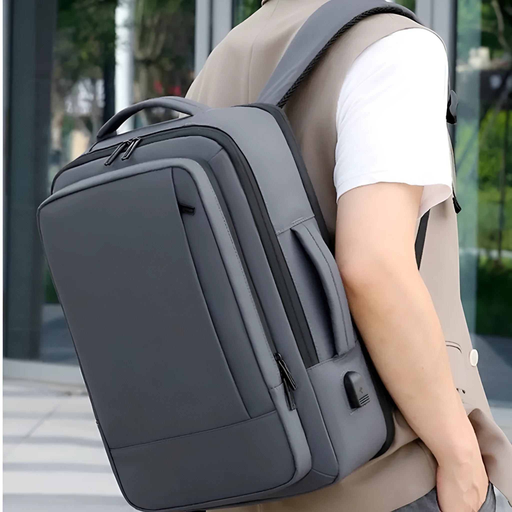 Waterproof Oxford cloth backpack in black with curved shoulder straps and business styling