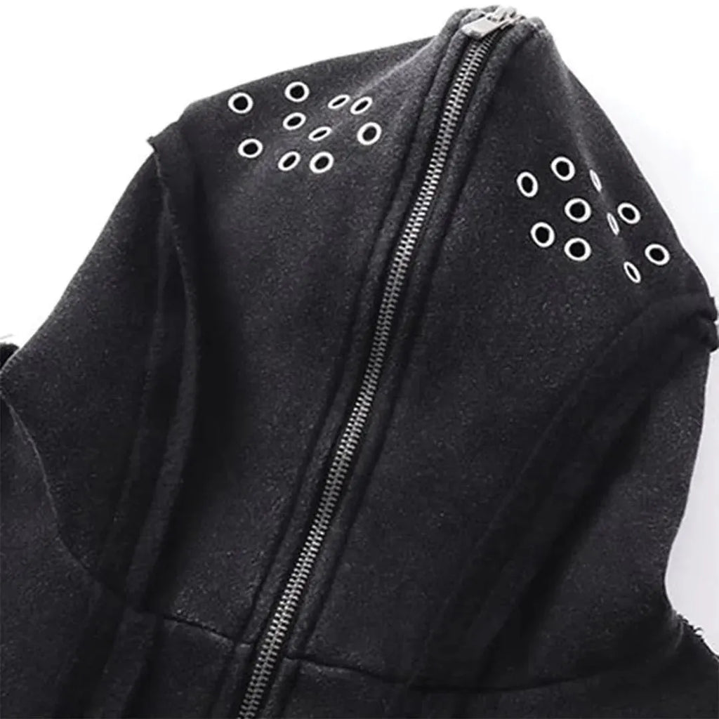 Man wearing a loose black zip-up hooded coat with a padded lining.