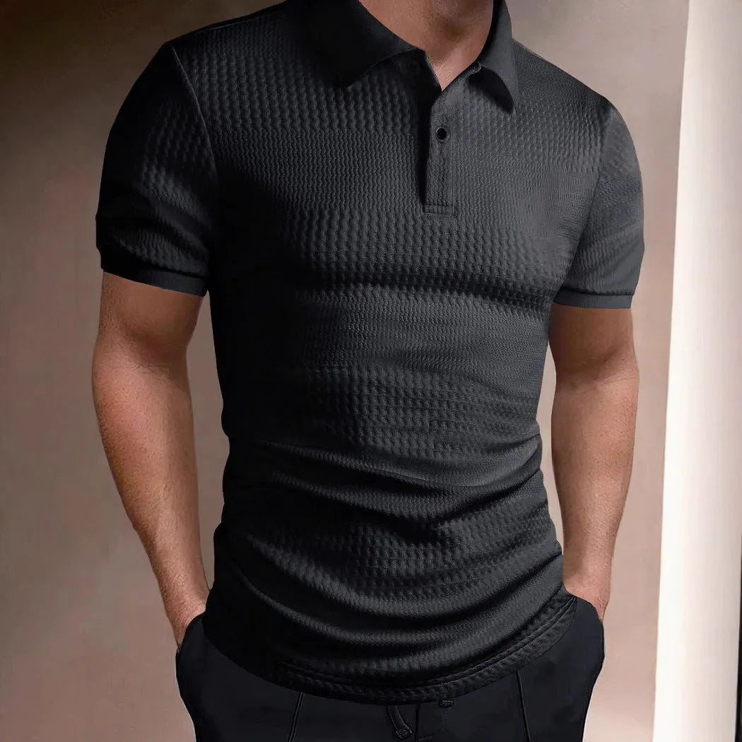 Man wearing a striped loose-fit polo shirt in light blue, showing short sleeves and asymmetric detail.