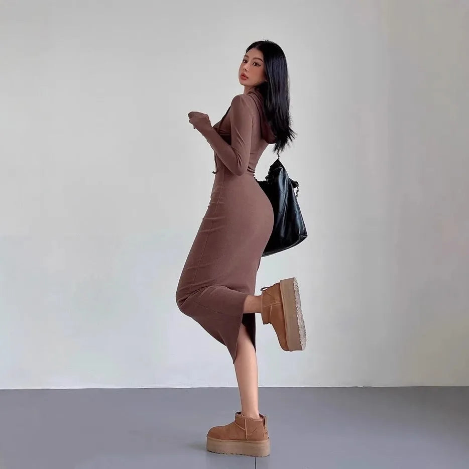 Women's grey hooded long sleeve sheath dress with a high waist on a model.