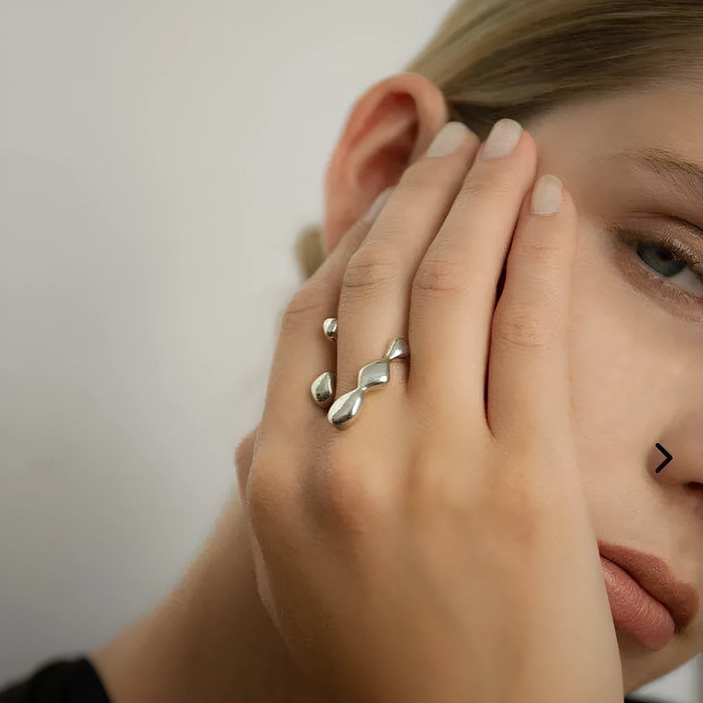 Brass fashion ring with spherical elements in circular design available in gold and silver colours