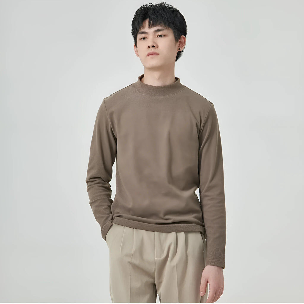 Man wearing a beige half-high collar long-sleeved T-shirt for casual autumn winter wear