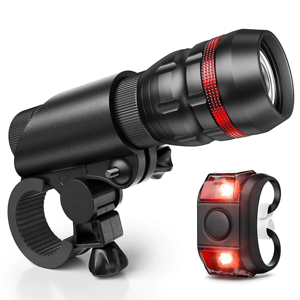 Bicycle front headlight and rear taillight set with a black handlebar mounting bracket on a white background.