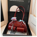 Women's brown PU leather retro pillow handbag with flap and ribbon pendant carried on shoulder