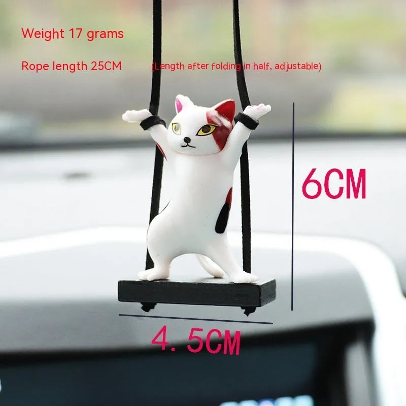Cartoon-style resin cat pendant for car interior decoration with adjustable rope.